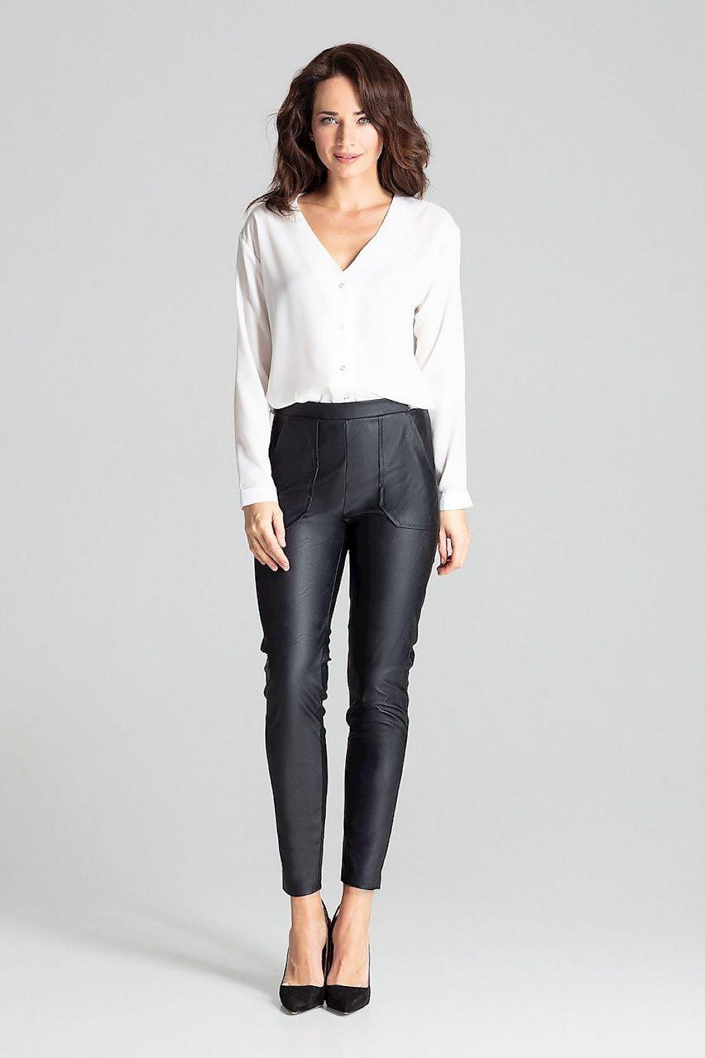 Black slim-fit eco-leather trousers with tapered legs and ankle-length cuffs