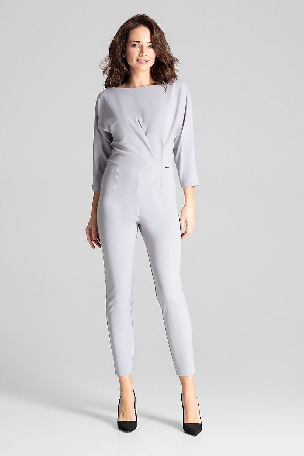 White 3/4-sleeve jumpsuit with front asymmetrical pleats and tapered ankle legs