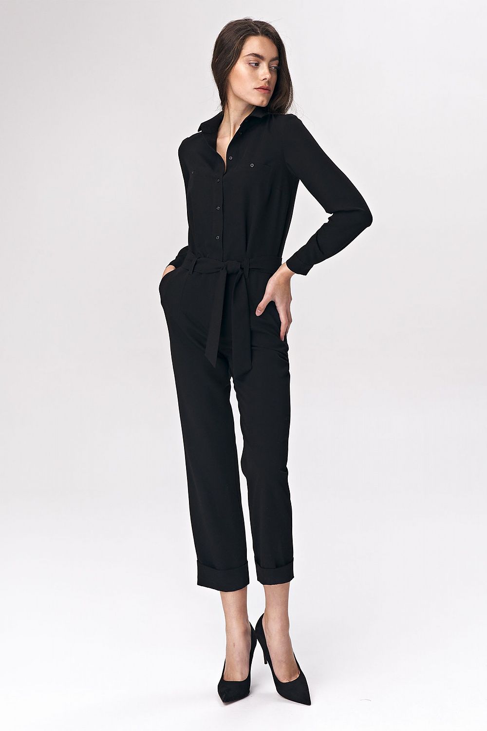 Black jumpsuit with waist tie, long sleeves, button front, tapered legs.