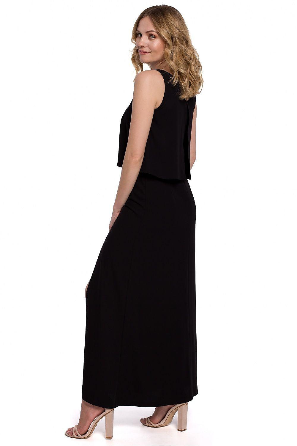 Black sleeveless cocktail dress with draped overlay top and long straight skirt