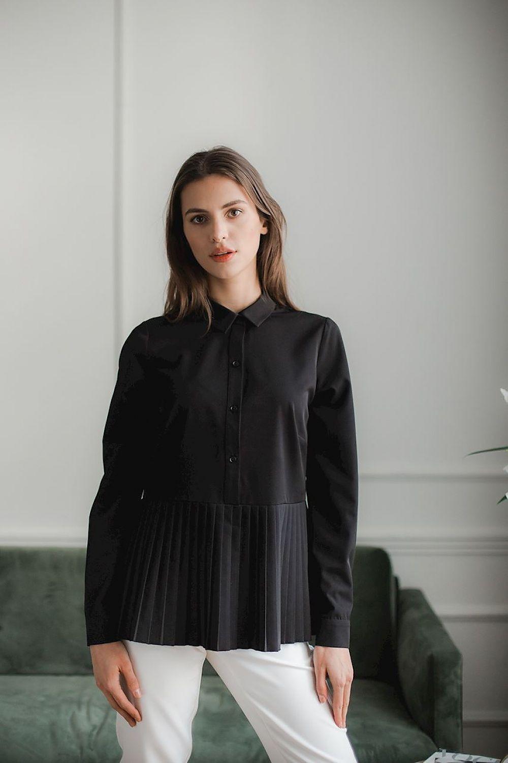 Black blouse with pleated ruffle hem and button-front, long sleeves