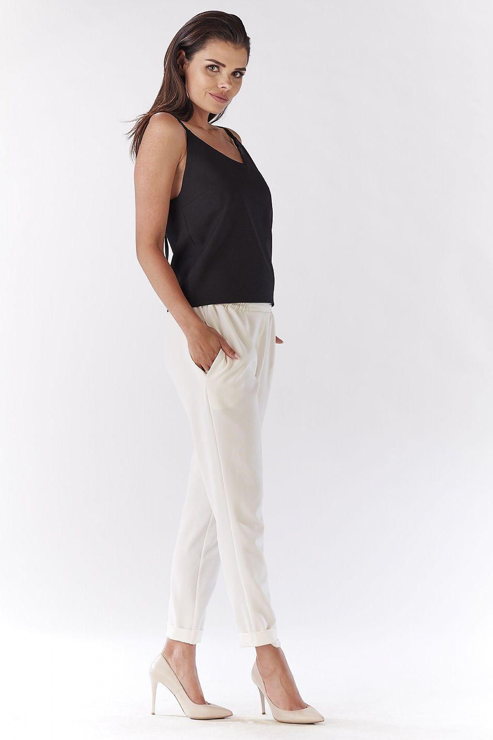 Beige tapered ankle trousers with cuffed hem and front pleat