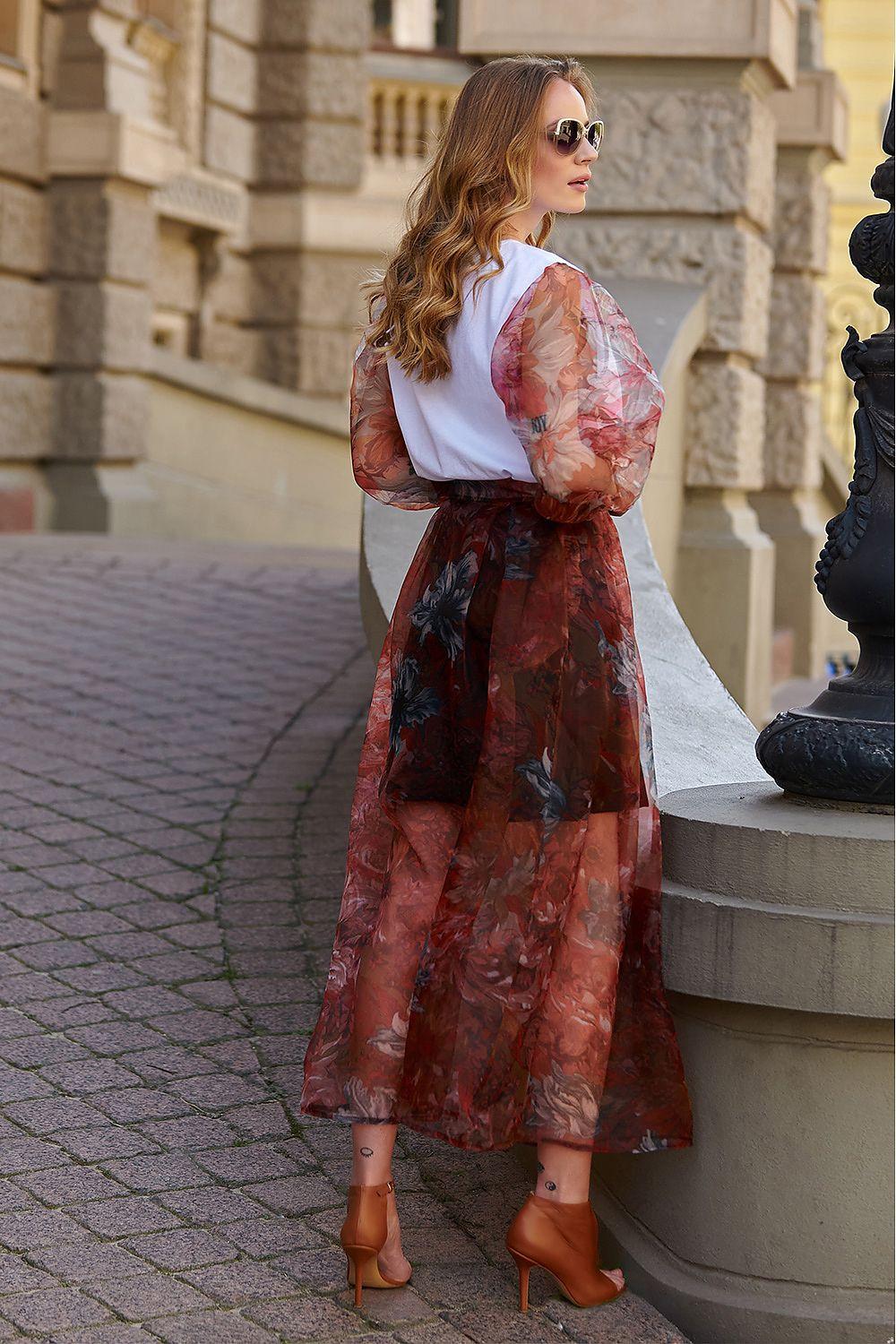 Long red floral printed skirt with belted waist and flared mid-calf silhouette