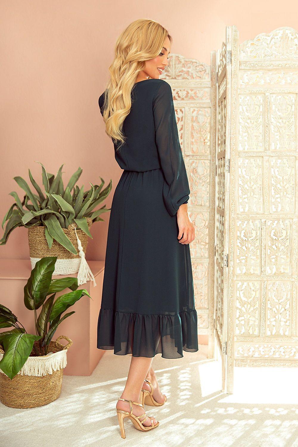 Black V-neck cocktail dress with long sleeves and ruffled hem, side view