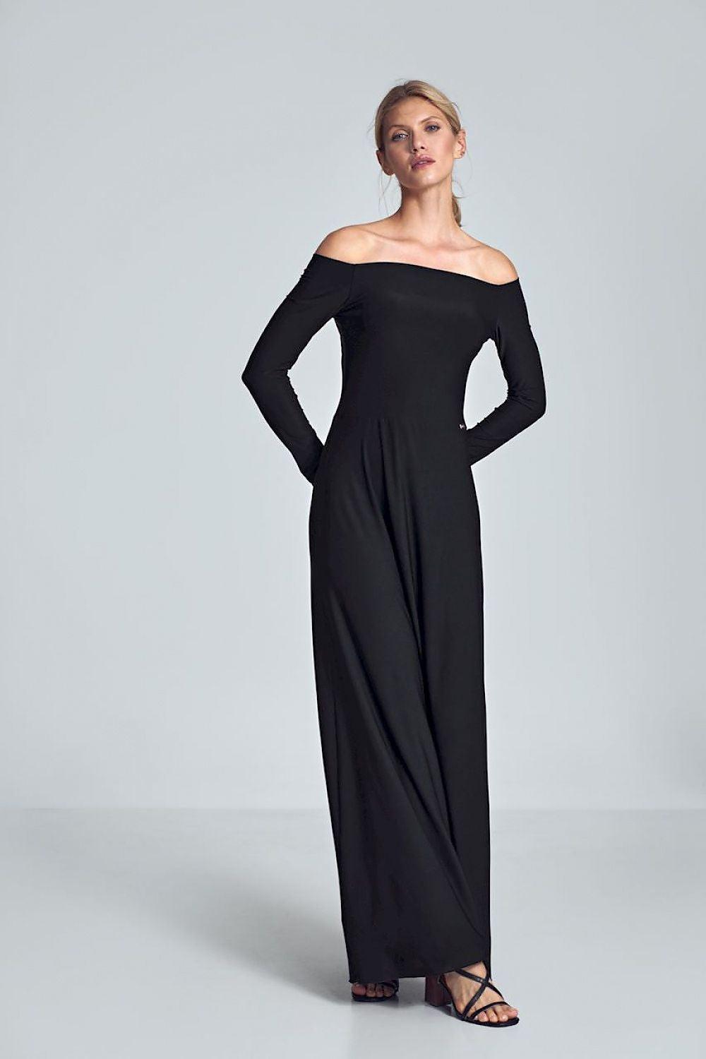 Black long off-shoulder dress with long sleeves and fitted, flowing silhouette.