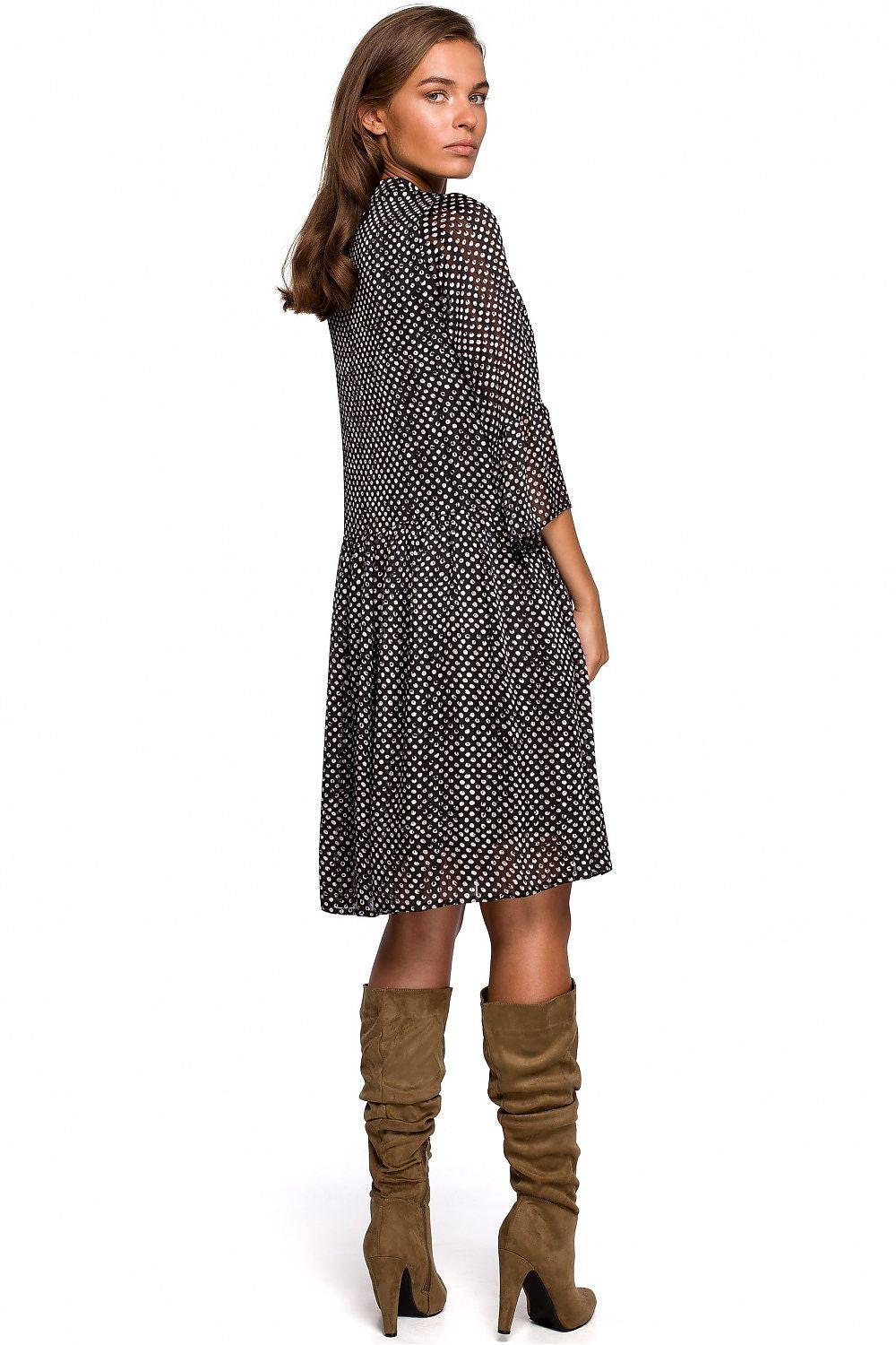 Black patterned day dress, back view, keyhole neck tie, flared 3/4 sleeves, midi hem