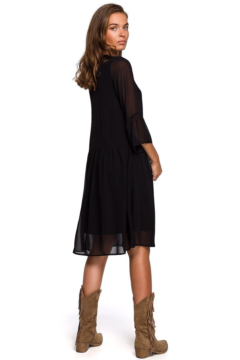 Black cocktail dress with V-neck and three-quarter sleeves, layered chiffon hem