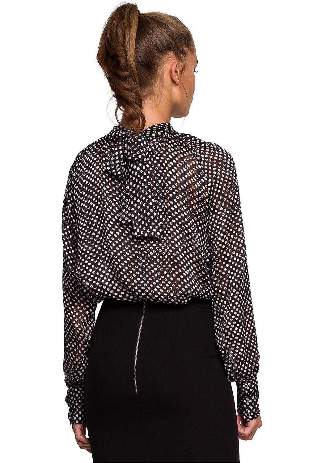 Back view long-sleeve blouse with high neck; dotted pattern and gathered collar
