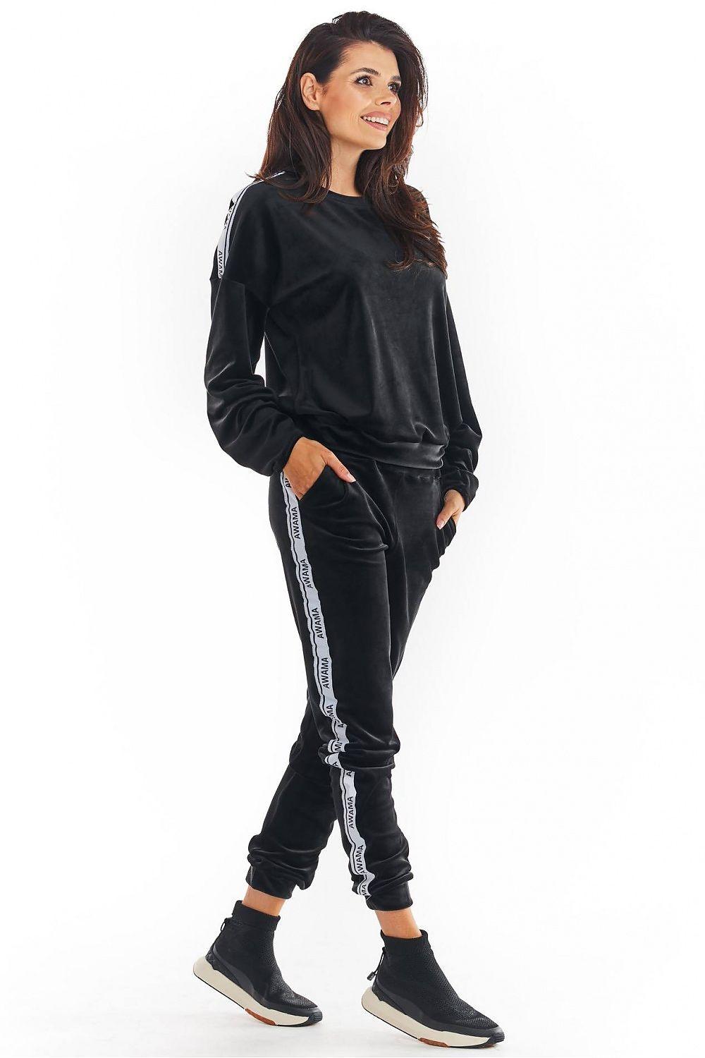 Awama black tracksuit trousers with side stripe and elastic cuffs, front view.