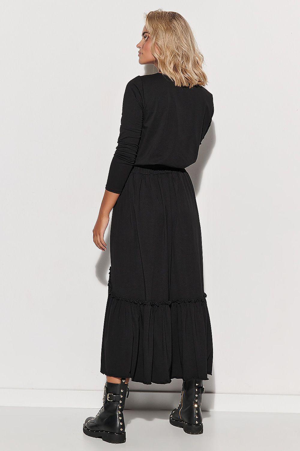 Black daydress with long sleeves, tiered ruffle skirt, and gathered waist, back view.