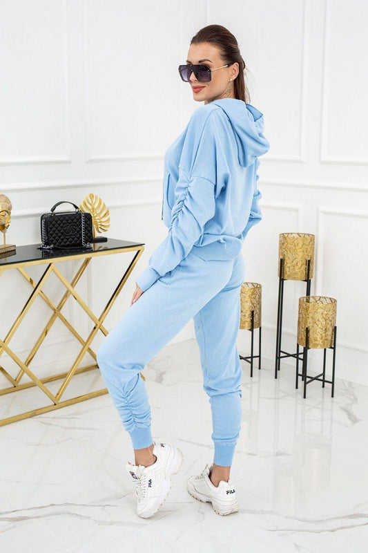 Light blue hooded tracksuit set with drawstring joggers, side view