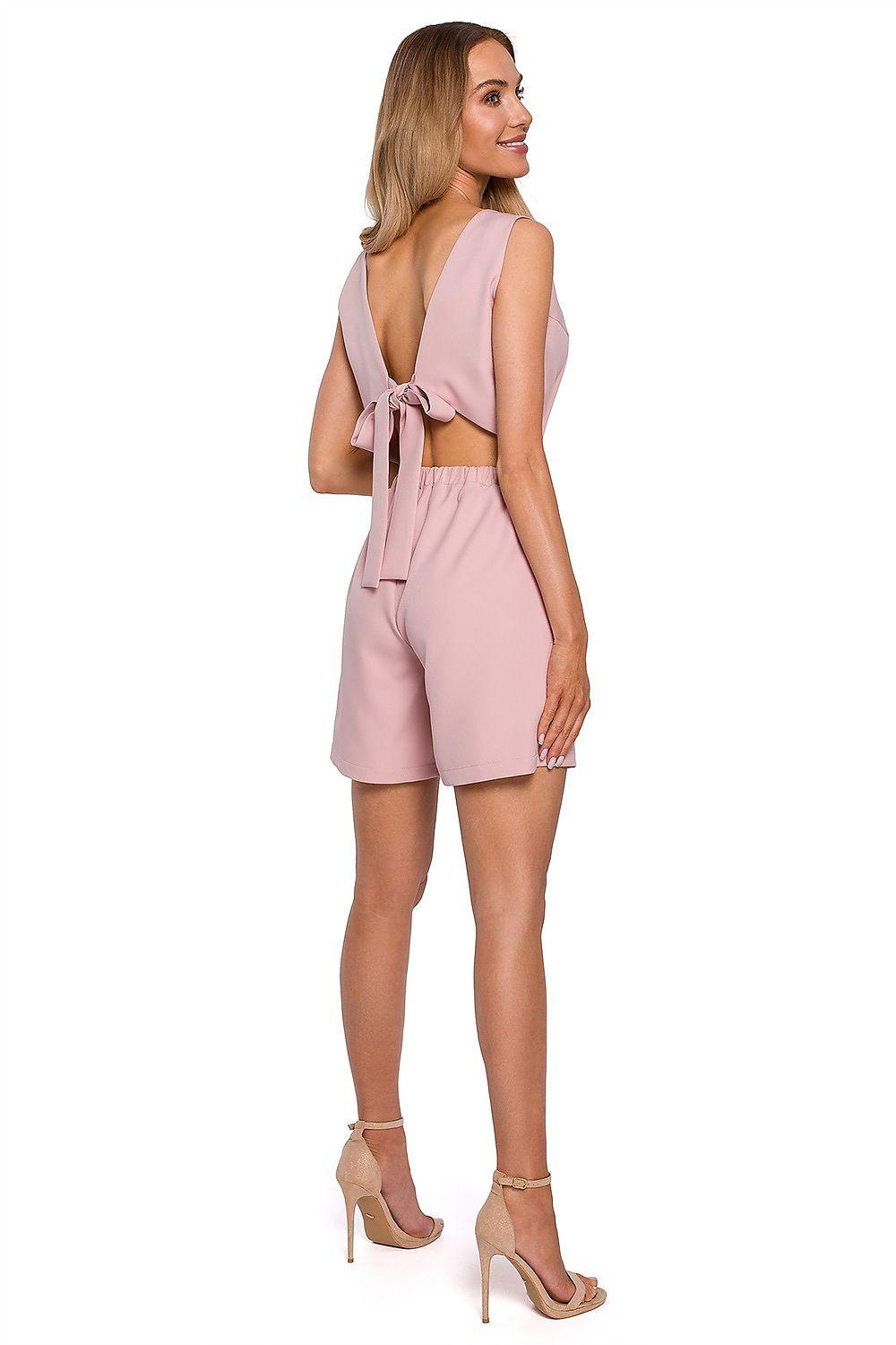 Pink sleeveless shorts set with open back and tie detail, fitted waist, high rise