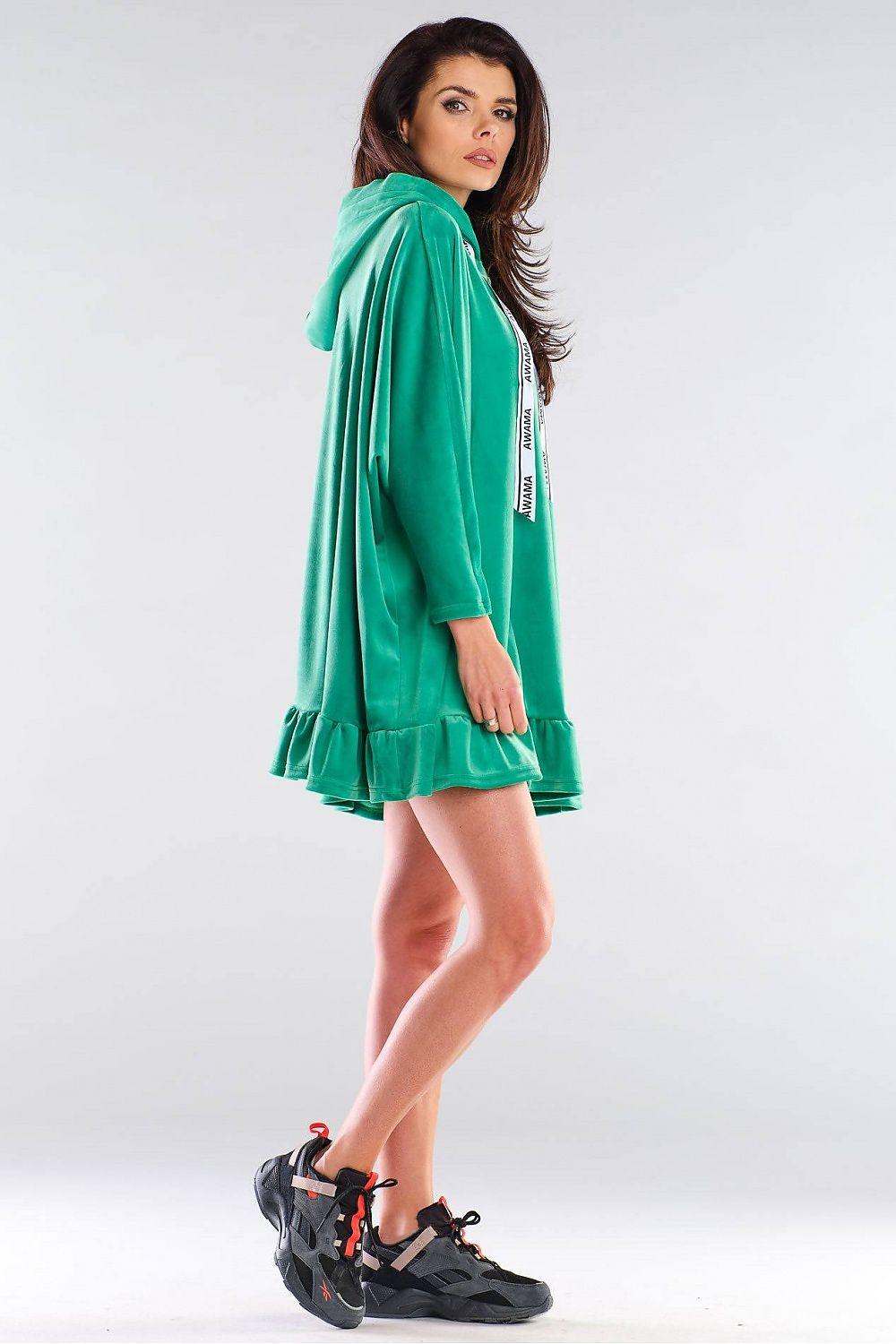 Green hooded daydress with long sleeves, tiered ruffle hem, side view