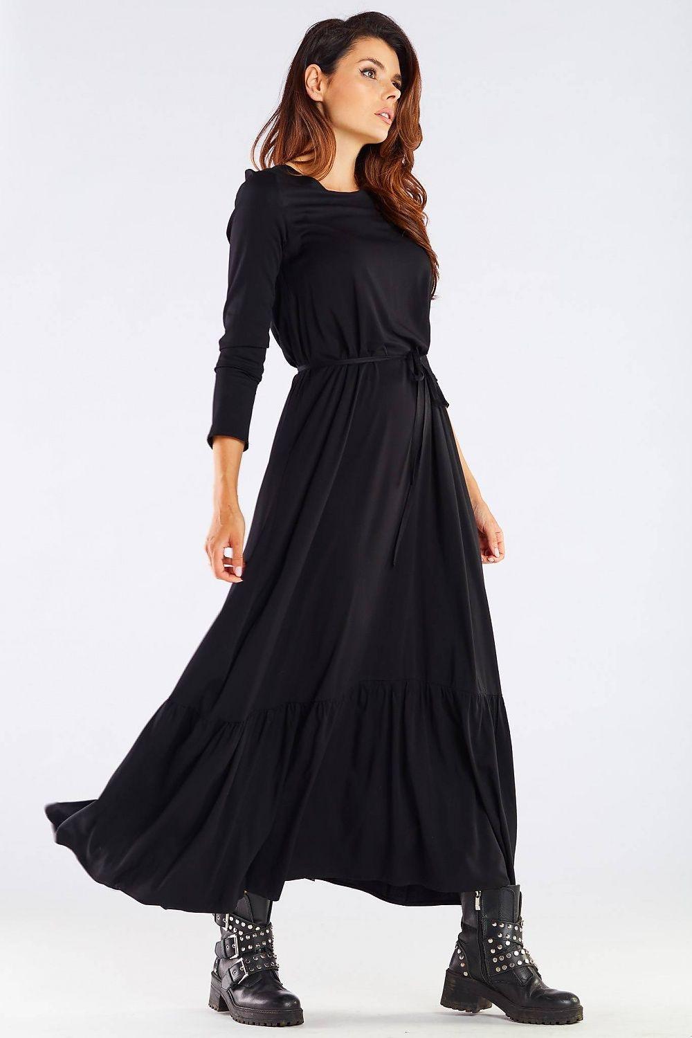Black long-sleeve daydress with ruched waist tie and flowing tiered skirt, front view