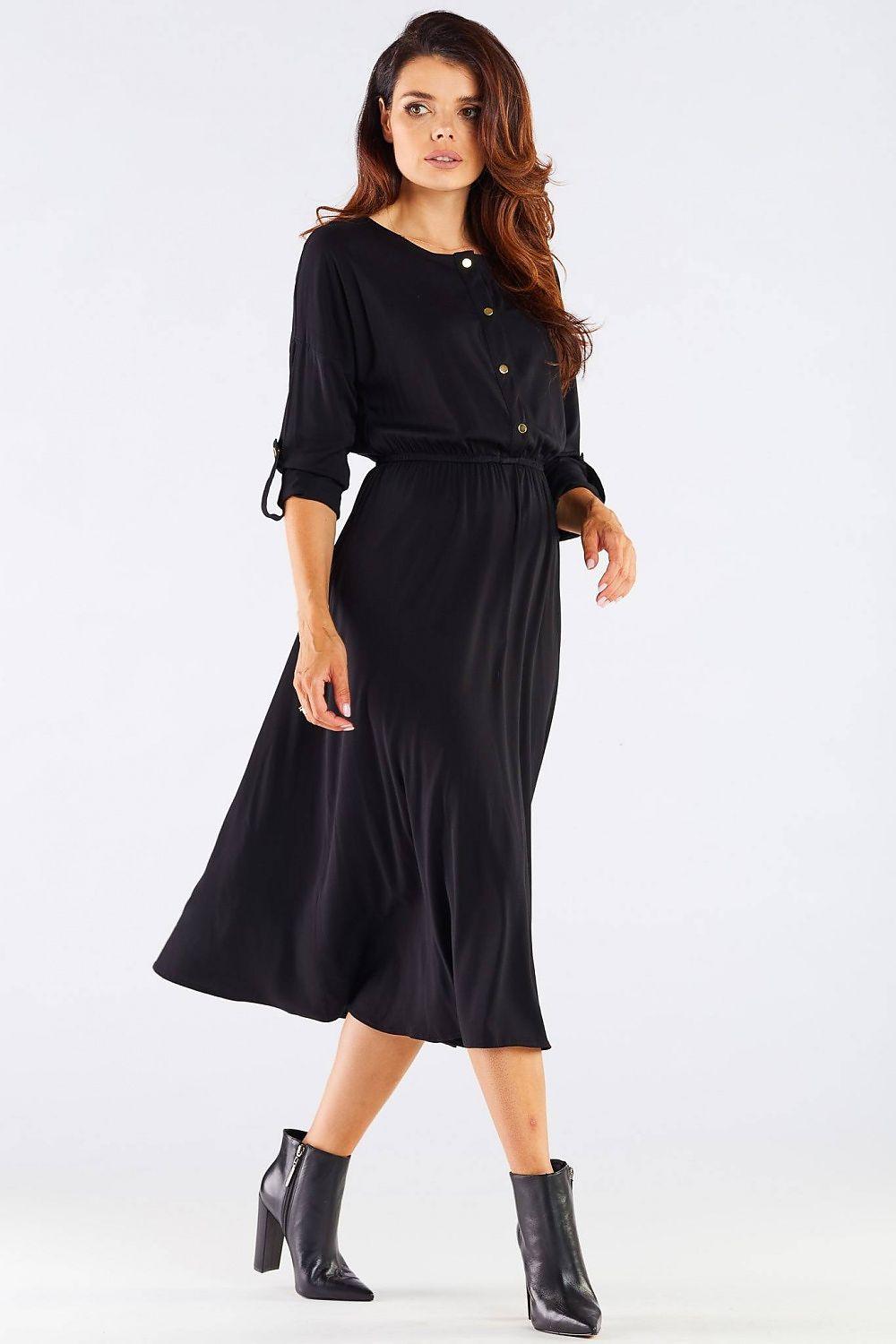 Black midi day dress with button placket and elastic waist, 3/4 sleeves, angled pose