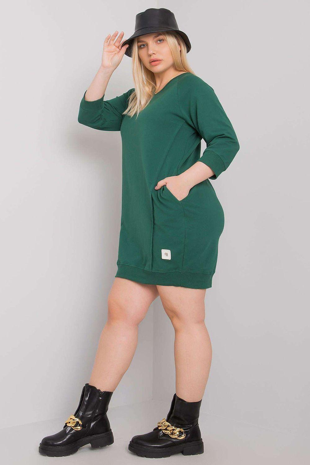 Green V-neck shift dress with 3/4 sleeves and side pockets, front view