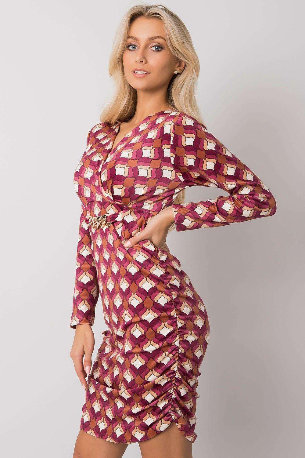 Pink patterned daydress with long sleeves, V-neck, and cinched waist.