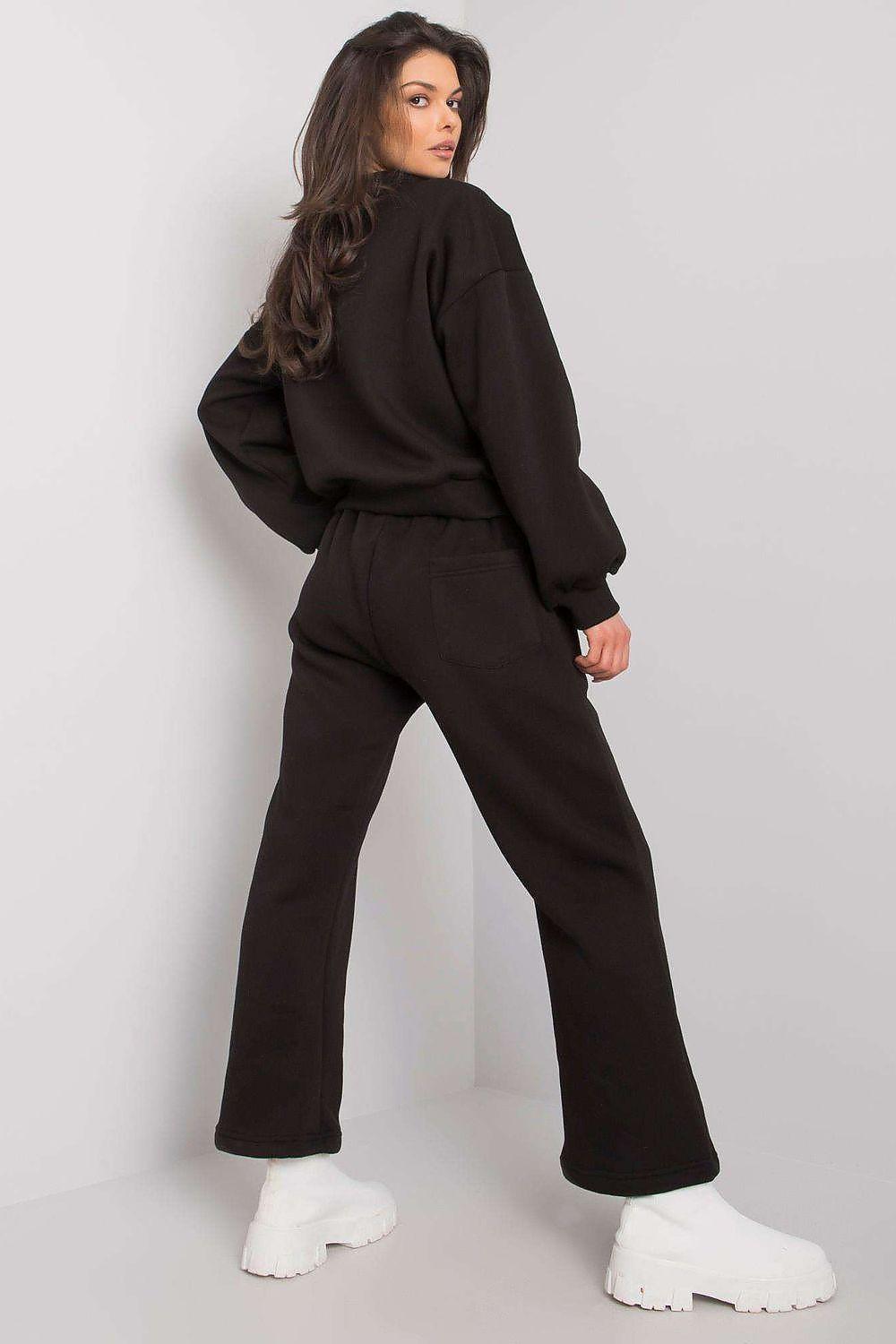 Black two-piece set with hoodie and wide-leg sweatpants, drawstring waist