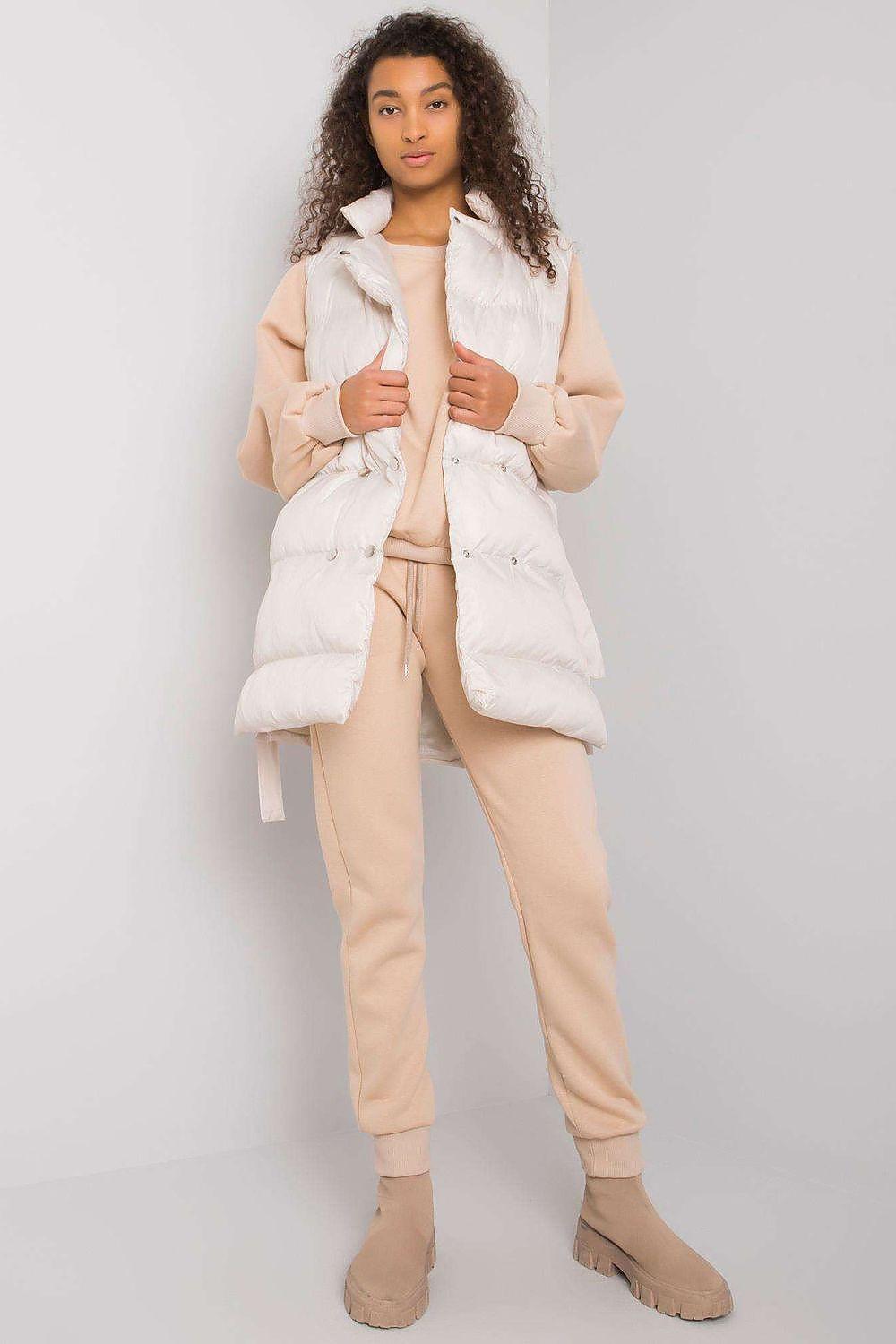 Light down vest and beige sweatpants set, sleeveless puffer style with zip front.