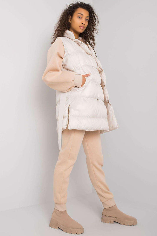 White quilted puffer jacket with hood and beige jogger pants set, side view