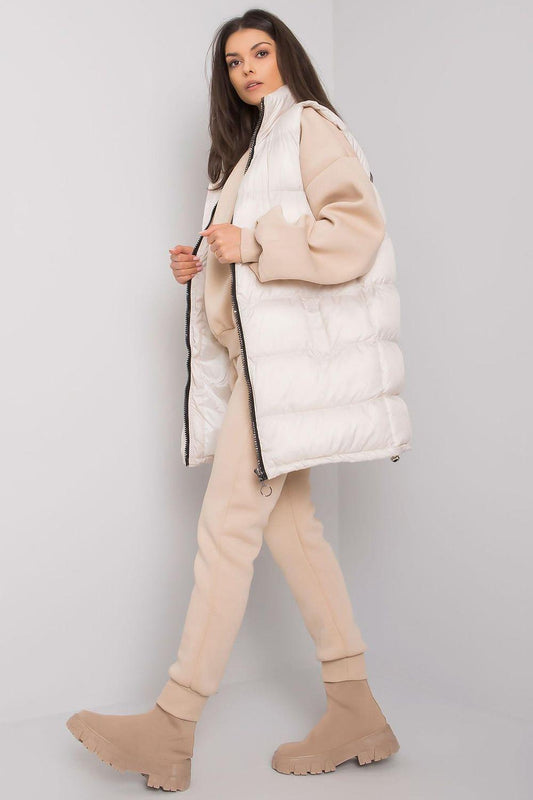 Beige puffer vest with hood and beige jogger set, side view
