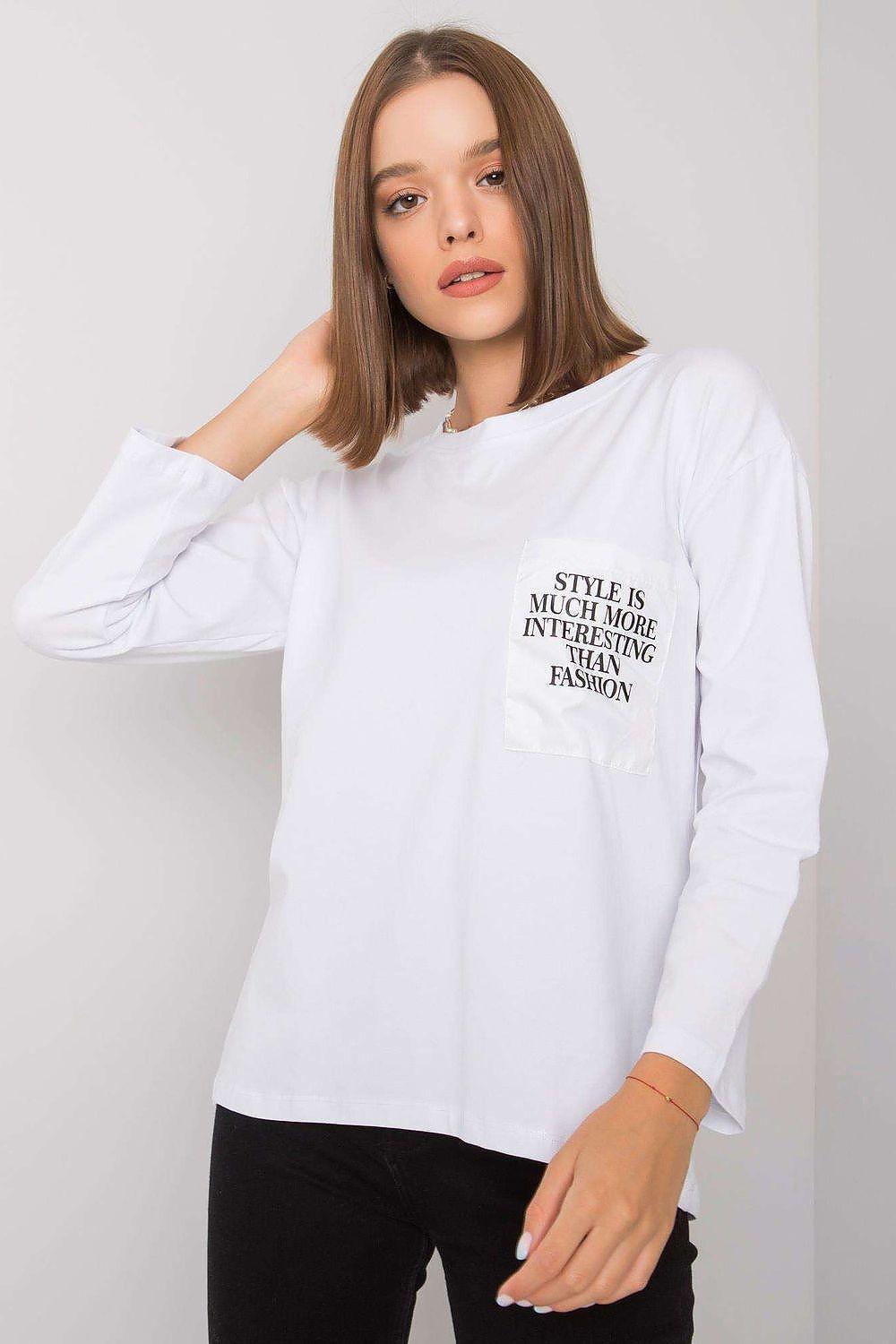 White cotton blouse with long sleeves and crew neck, small chest text