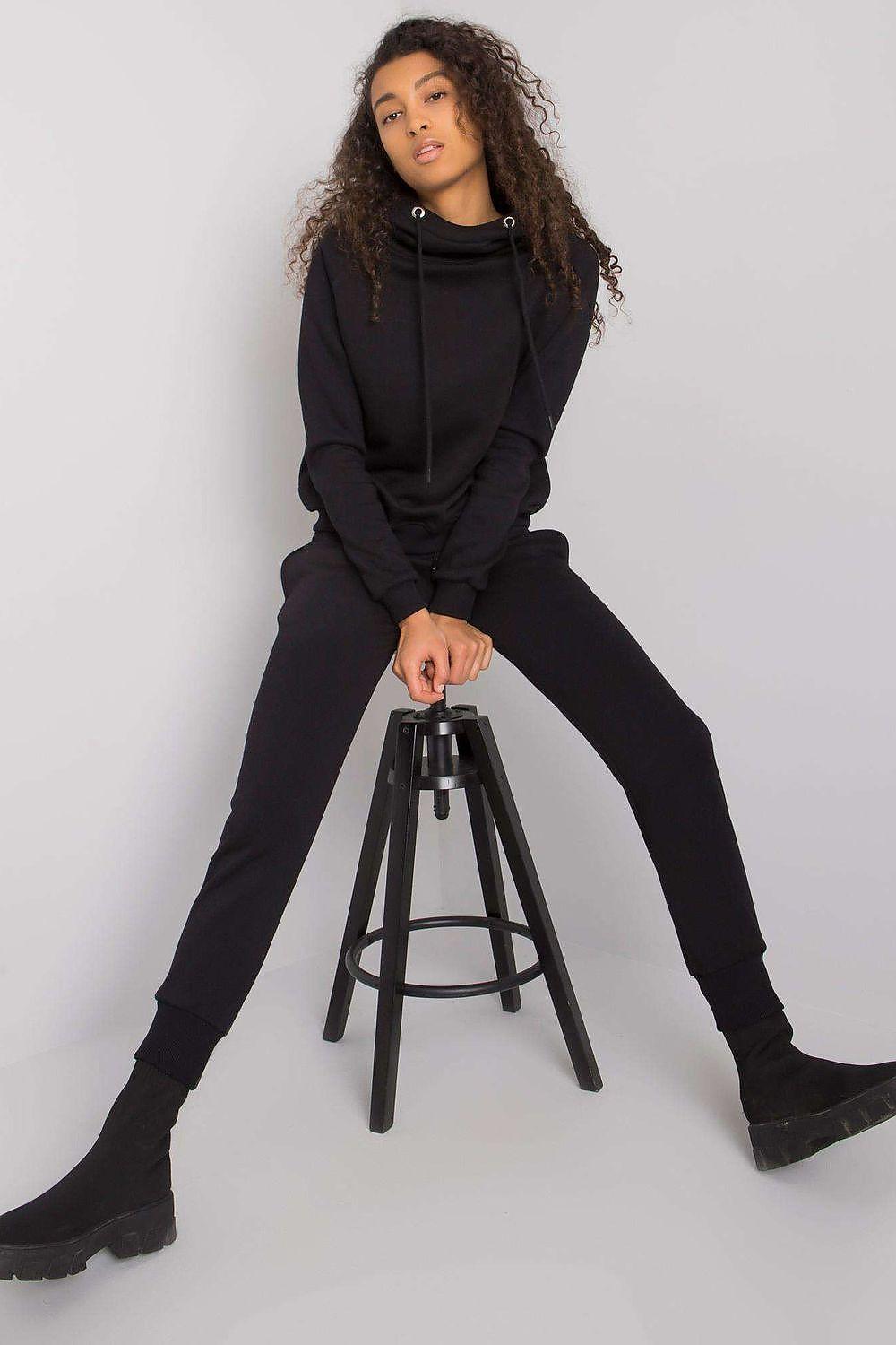 Black tracksuit set with zip hoodie and jogger pants, full outfit view