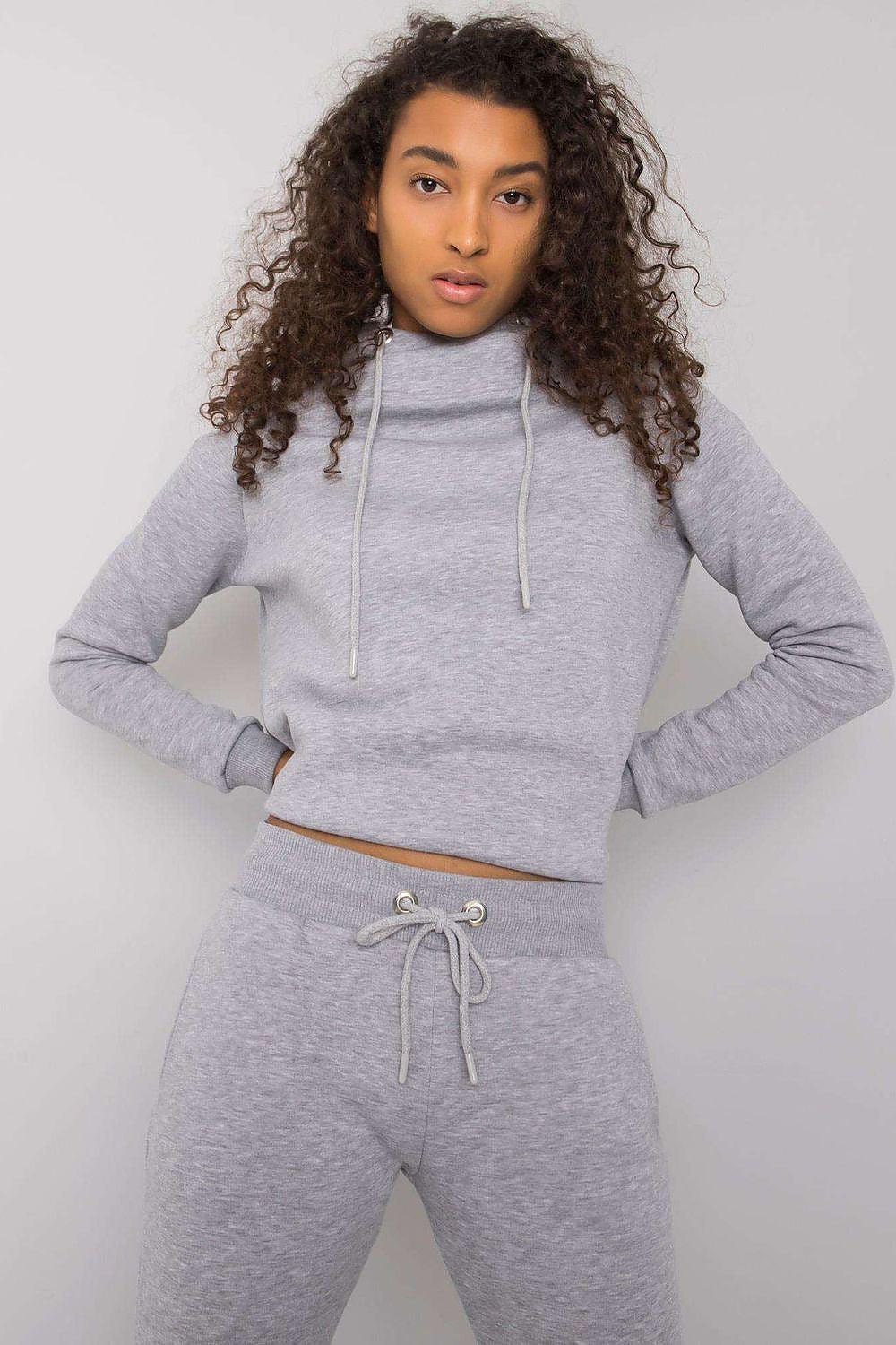Grey hoodie and jogger set with drawstring hood and waistband tie
