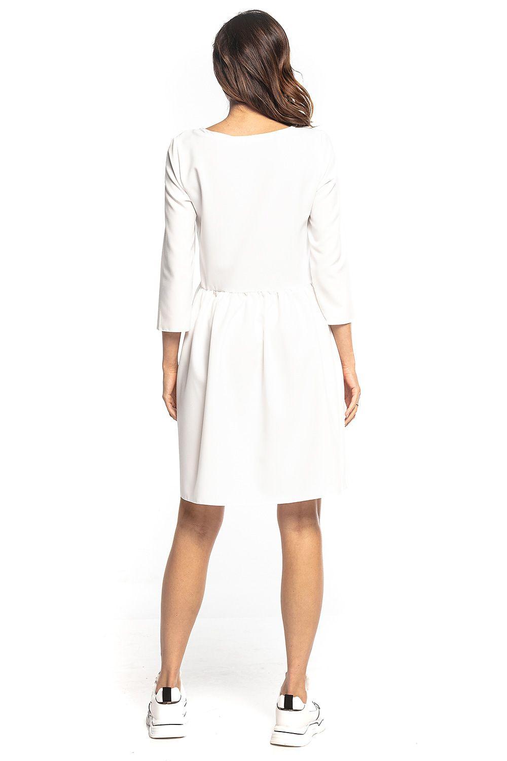Back view of white Tessita daydress with 3/4 sleeves and gathered waist seam