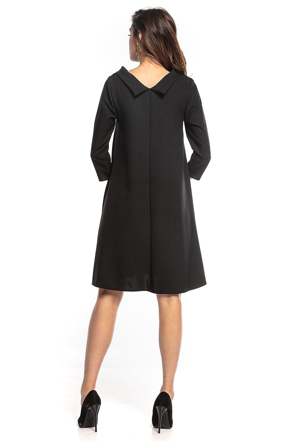 Black daydress with V-back yoke, elbow-length sleeves, A-line knee-length hem
