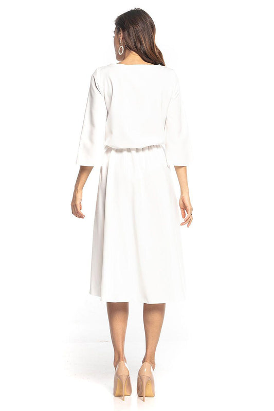White long-sleeve day dress with gathered waist and flared skirt, back view.