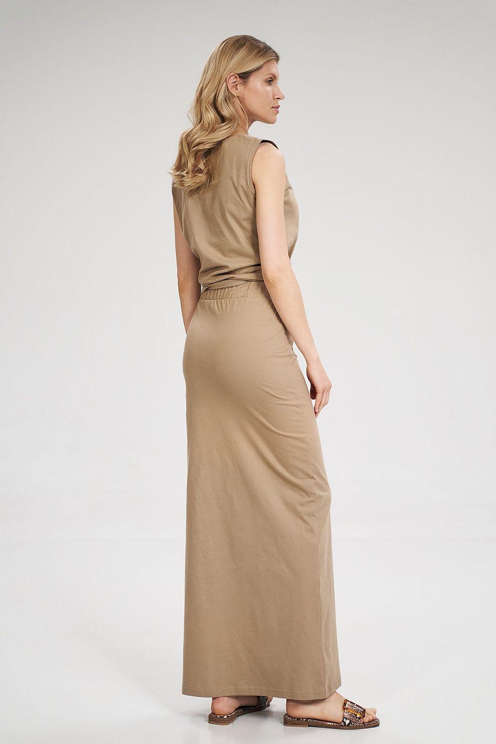 Long beige maxi skirt, side view, with tie waist and slit