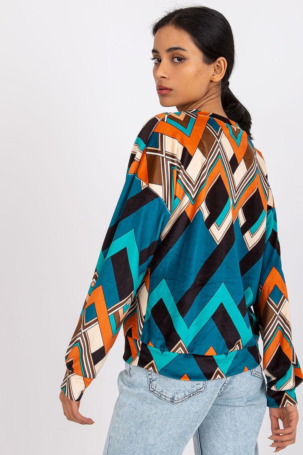 Teal geometric print blouse with long sleeves and crew neckline, back view