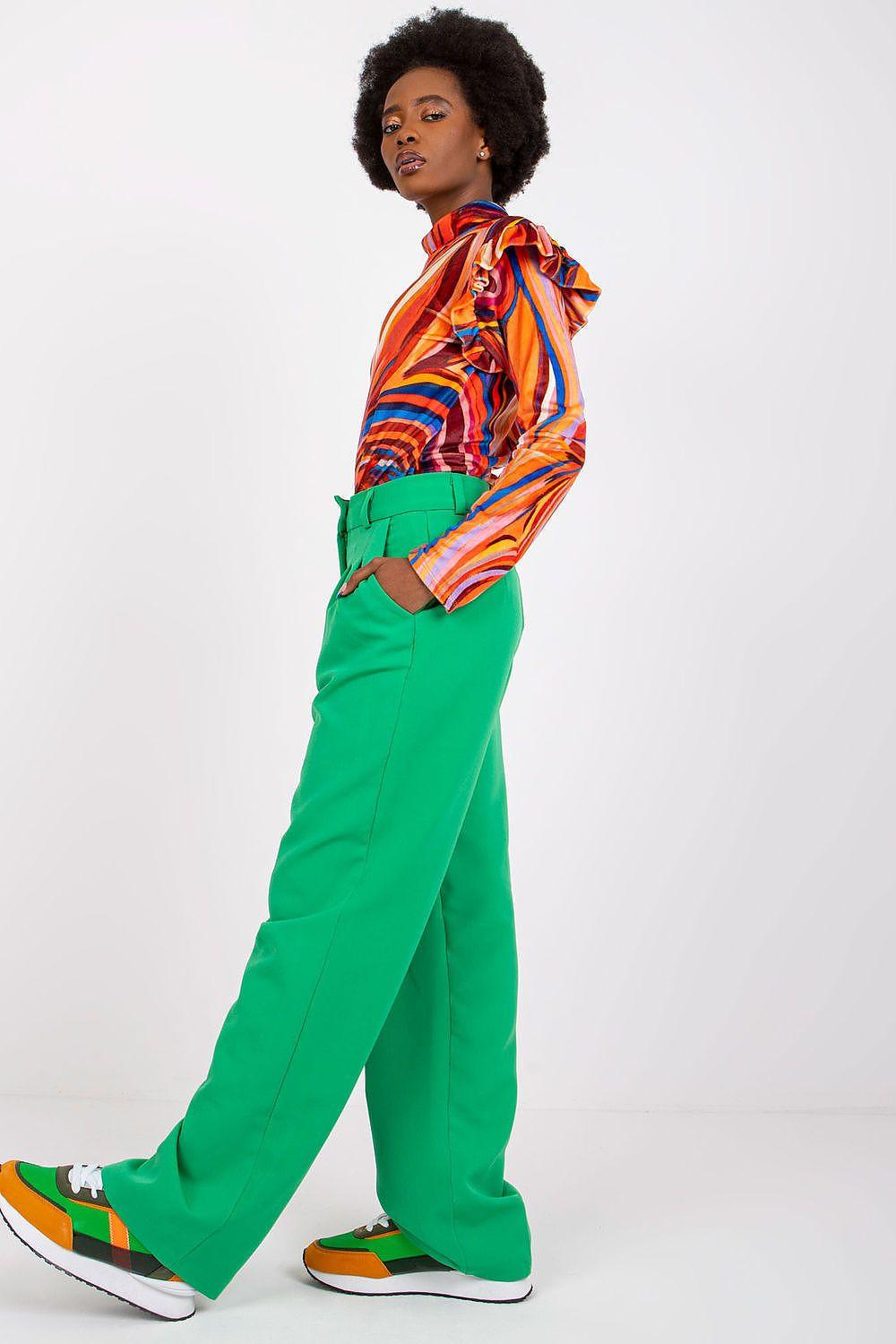 Orange multicolor striped blouse with long sleeves and high collar, angled view