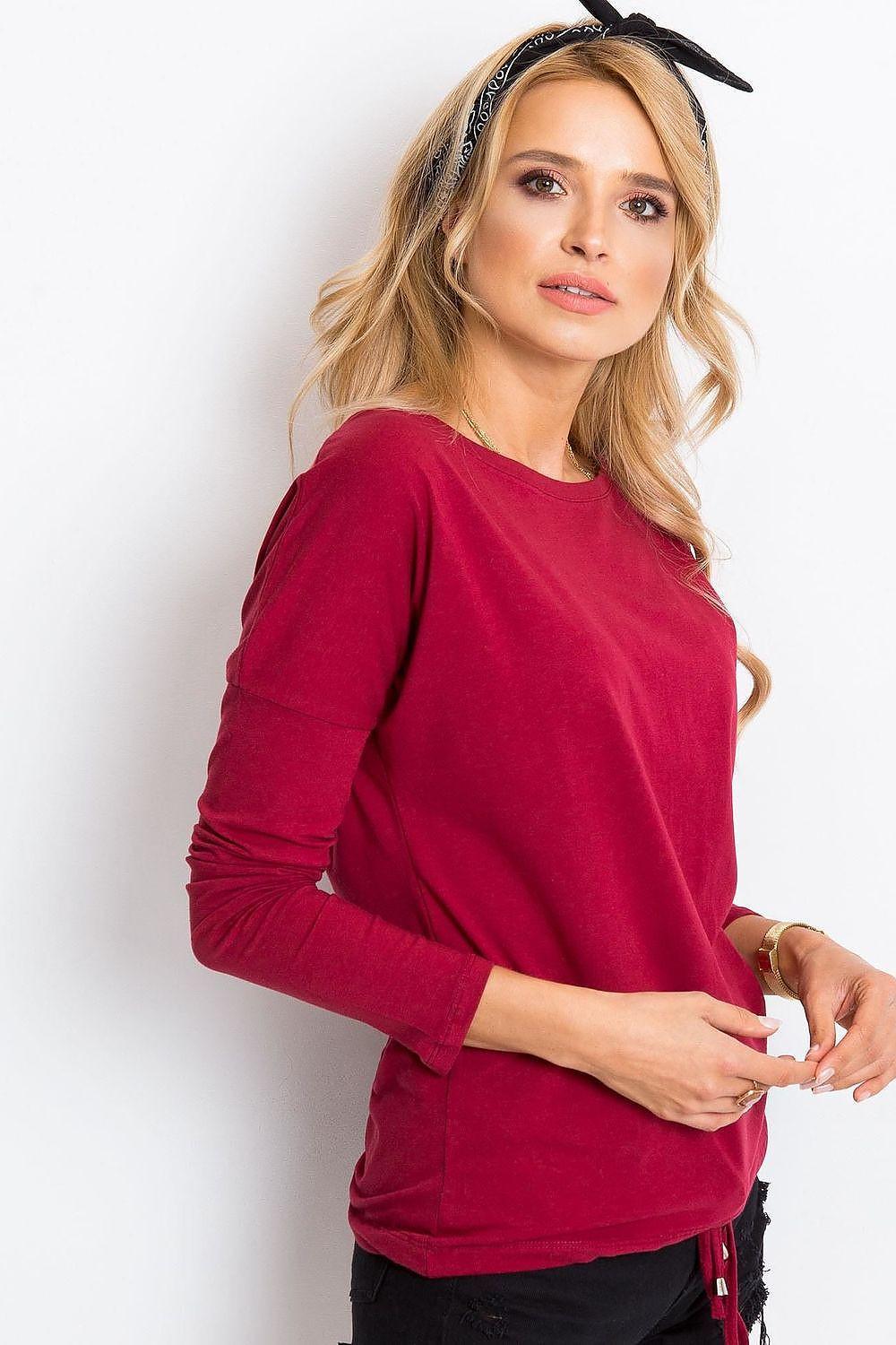 Red long-sleeve blouse with round neckline and draped shoulders