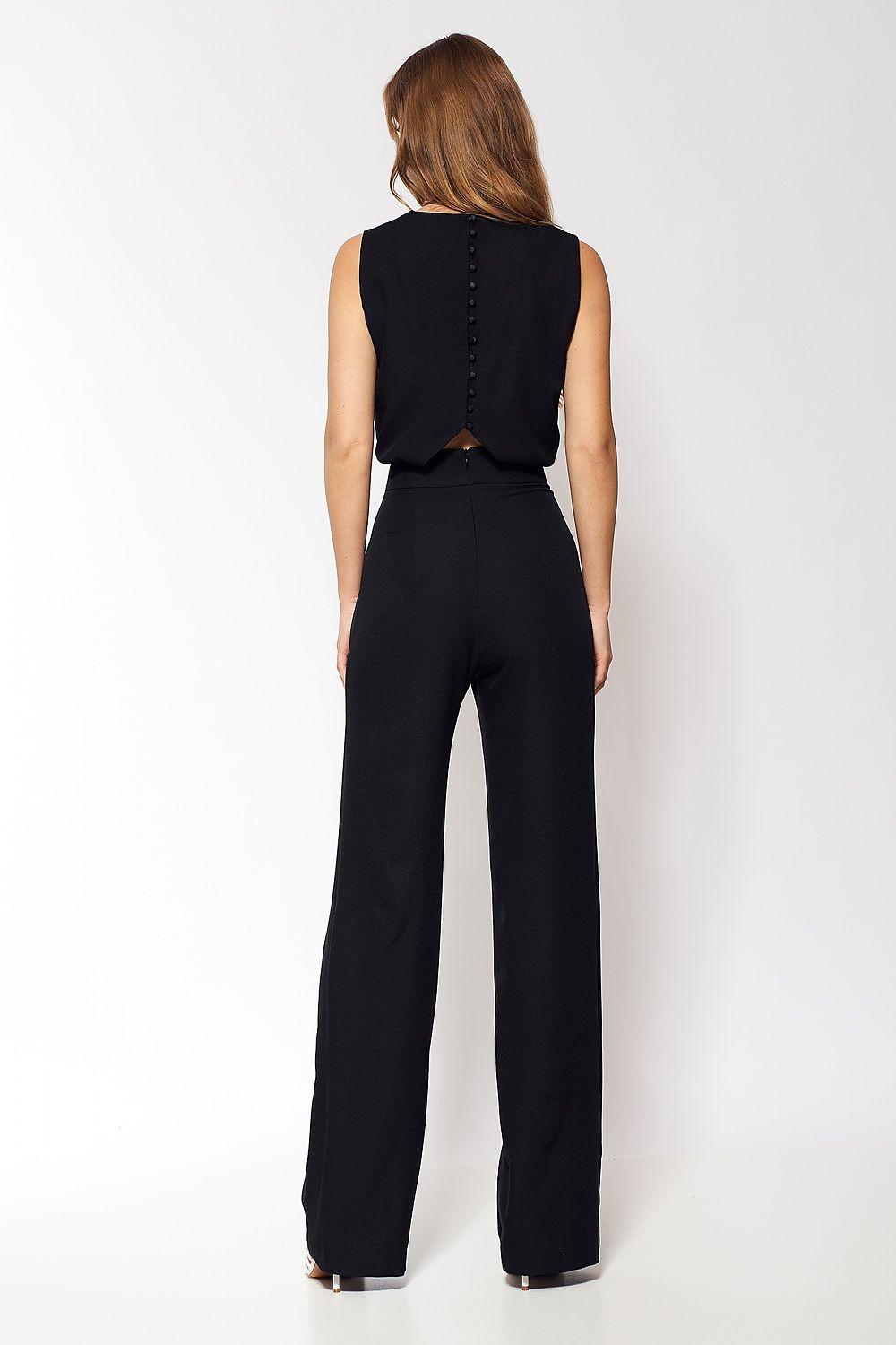 Black sleeveless open-back jumpsuit with button detail and wide-leg pants