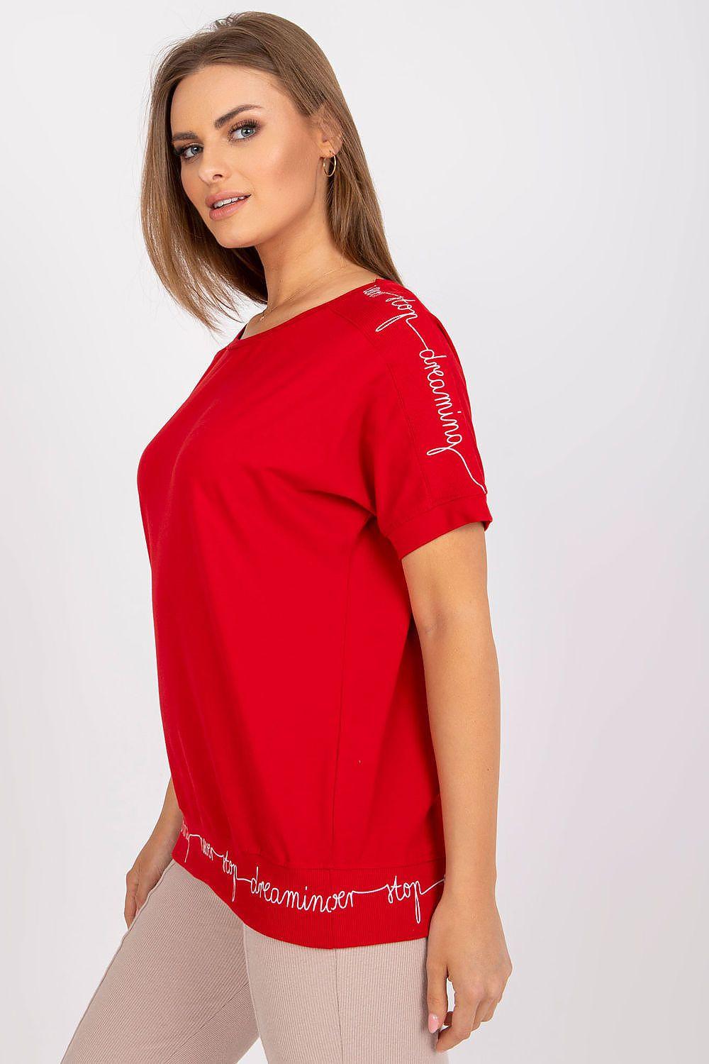 Red blouse with short sleeves and crew neck, script print on sleeve and hem.