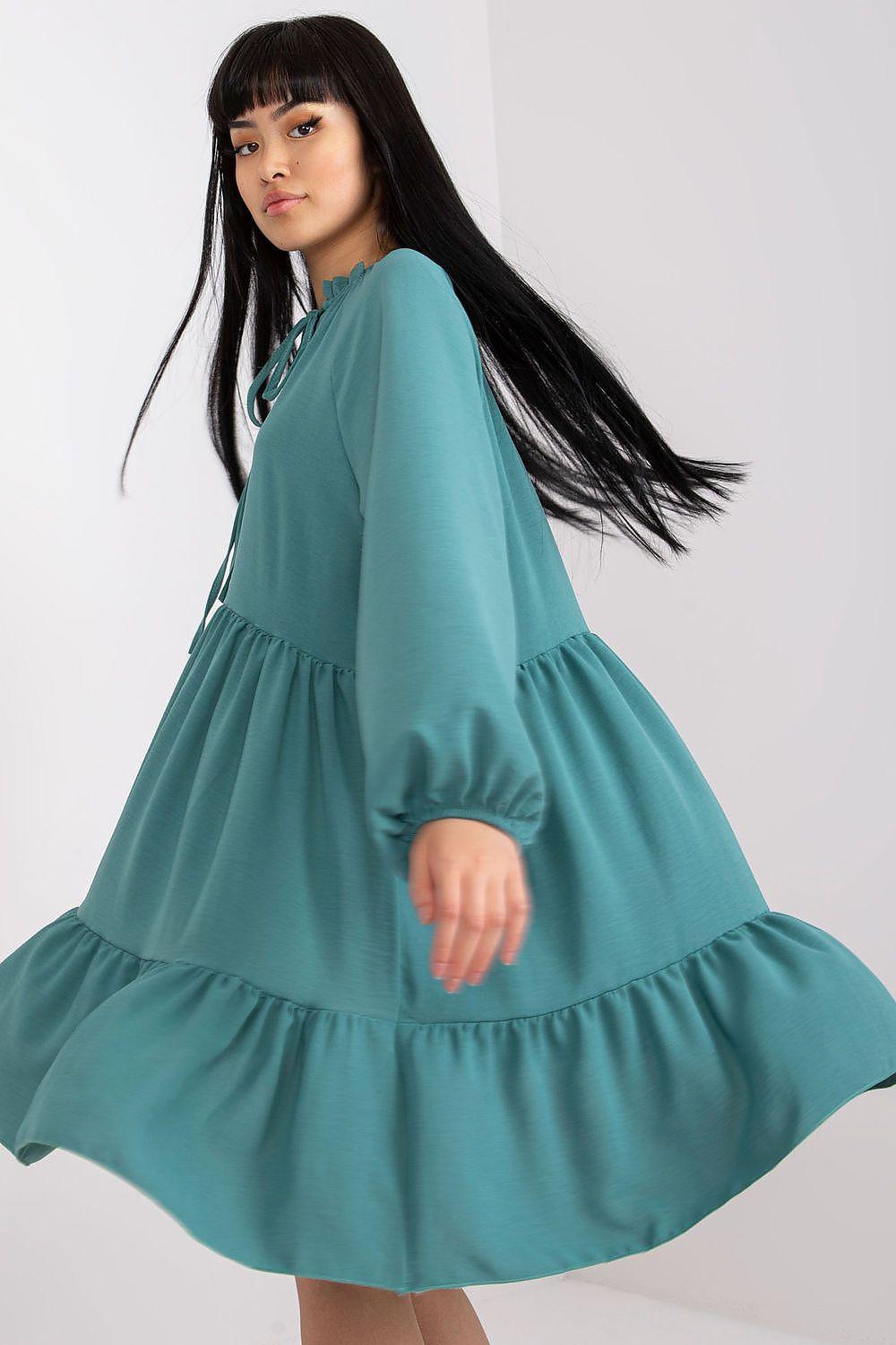 Teal tiered long-sleeve daydress with bow tie and flared skirt