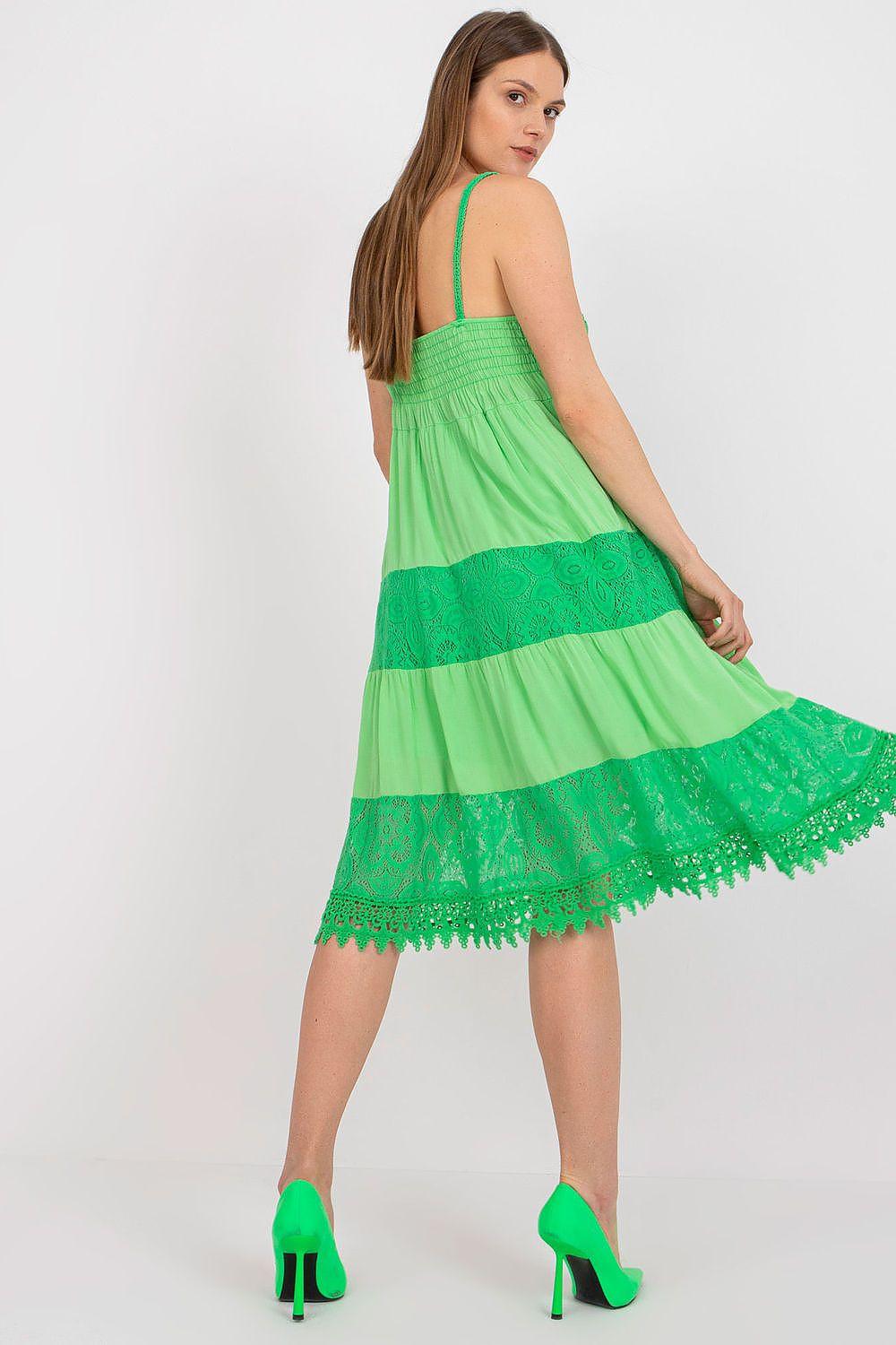 Green sleeveless daydress with thin straps and tiered lace ruffle hem