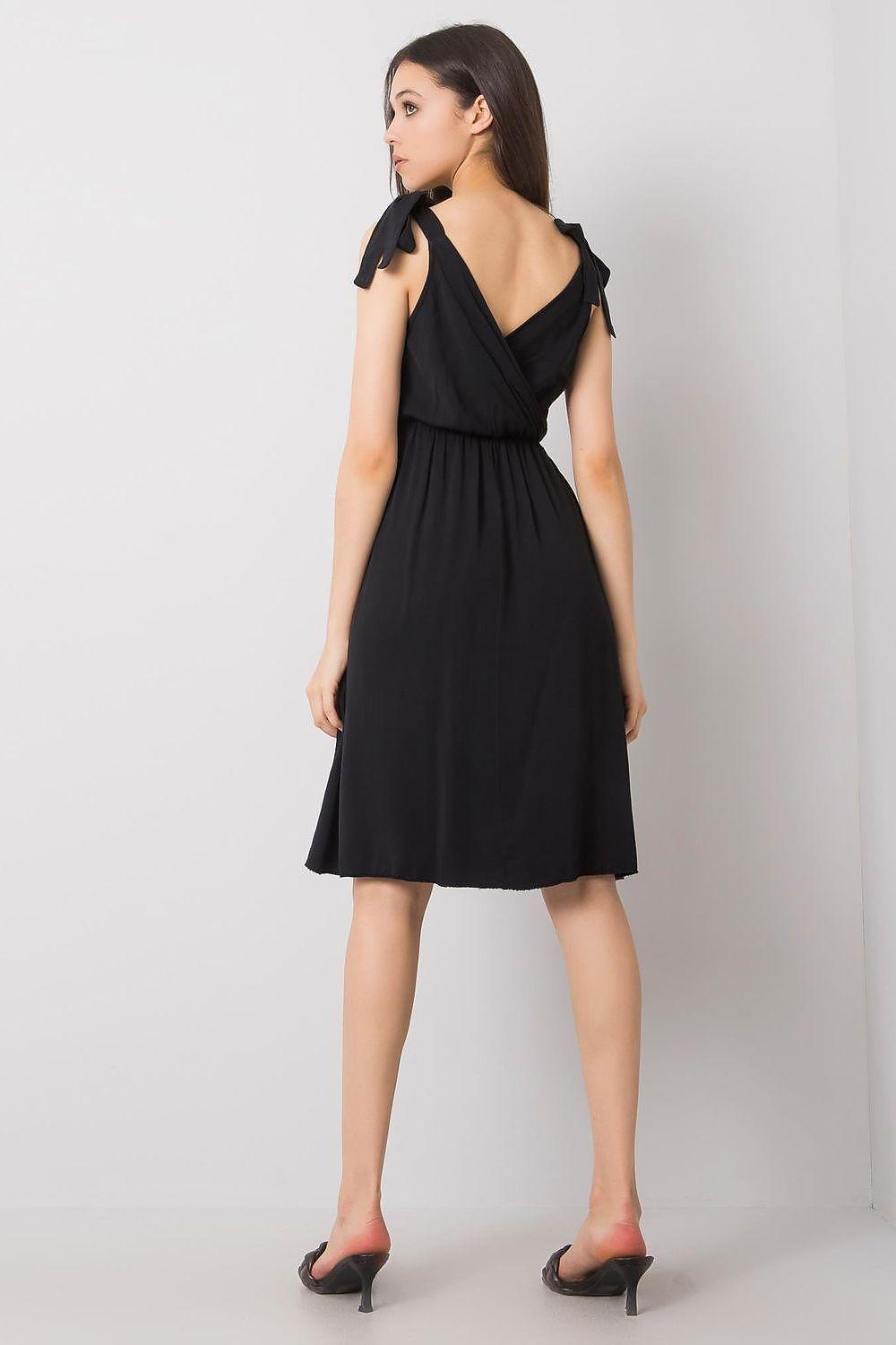 Black sleeveless day dress with open V back and gathered waist, knee-length