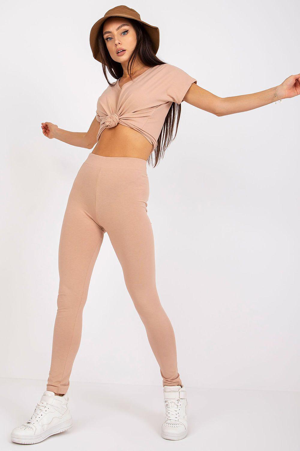 Tan high-waist cotton leggings with tapered slim legs