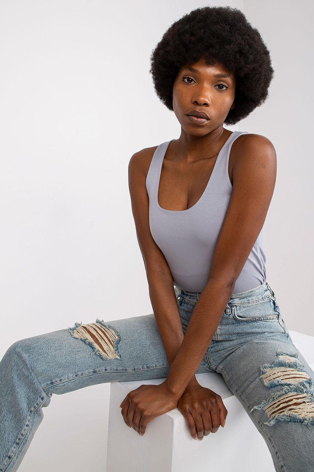 Light grey sleeveless tank top with scoop neckline, side seams