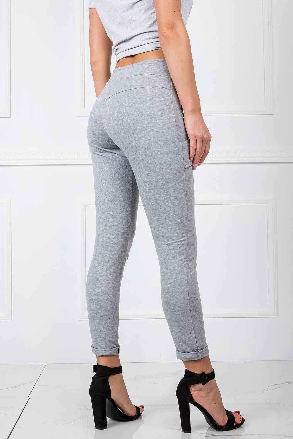 Grey tracksuit trousers with drawstring waist and tapered ankle cuffs, rear view