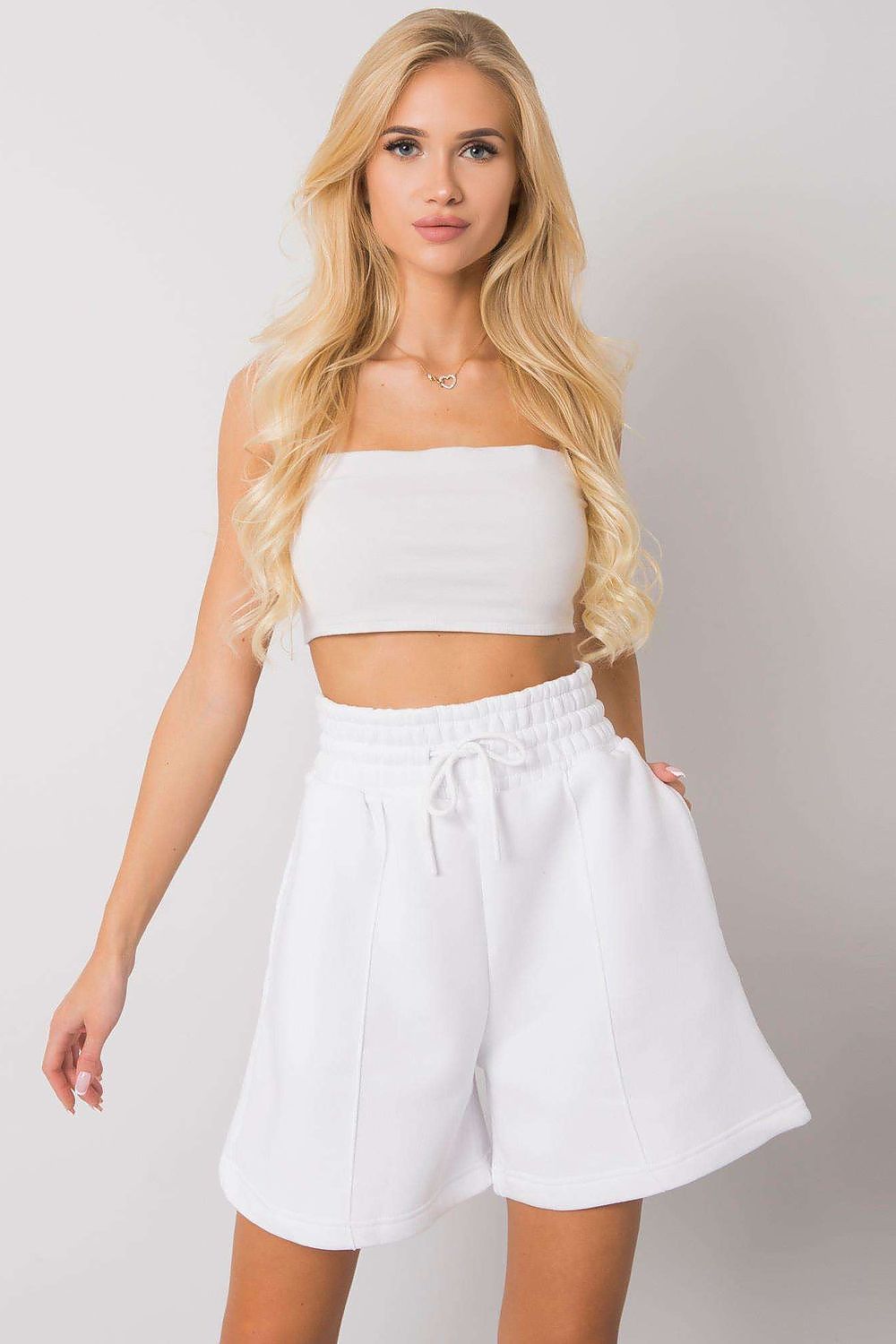 Women's white cotton shorts with elastic waist and drawstring, relaxed fit