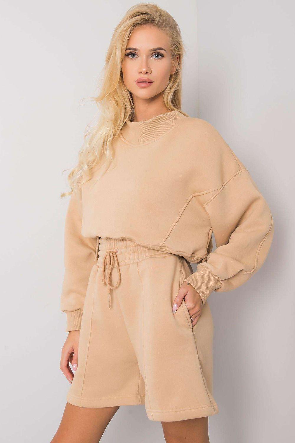 Beige drawstring shorts with elastic waist, above-knee length.