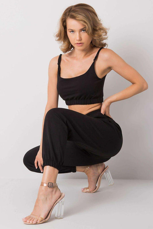 Black two-piece set: cropped camisole tank top with jogger pants and drawstring waist