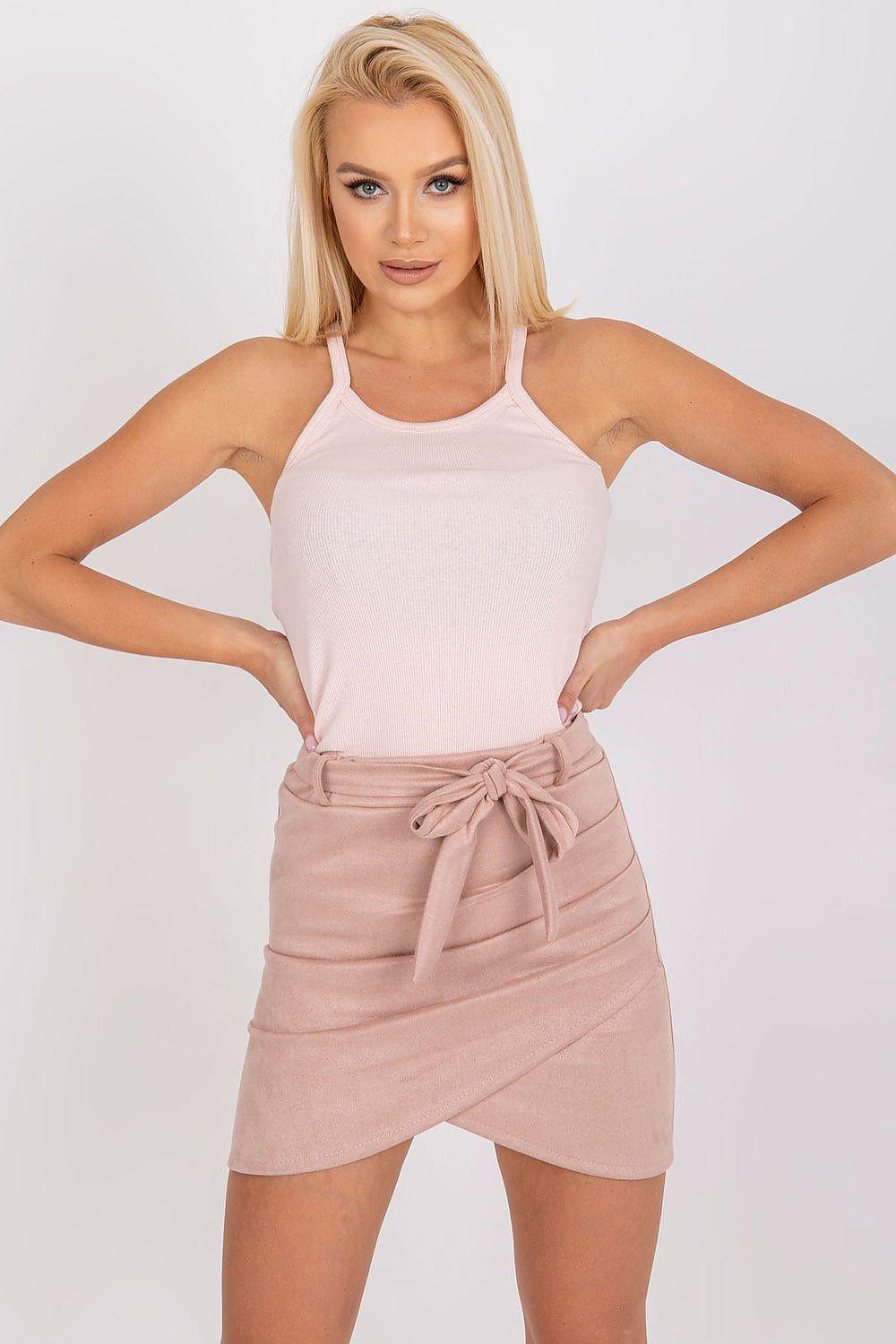 Light pink camisole tank top with thin straps and scoop neckline, hands on hips