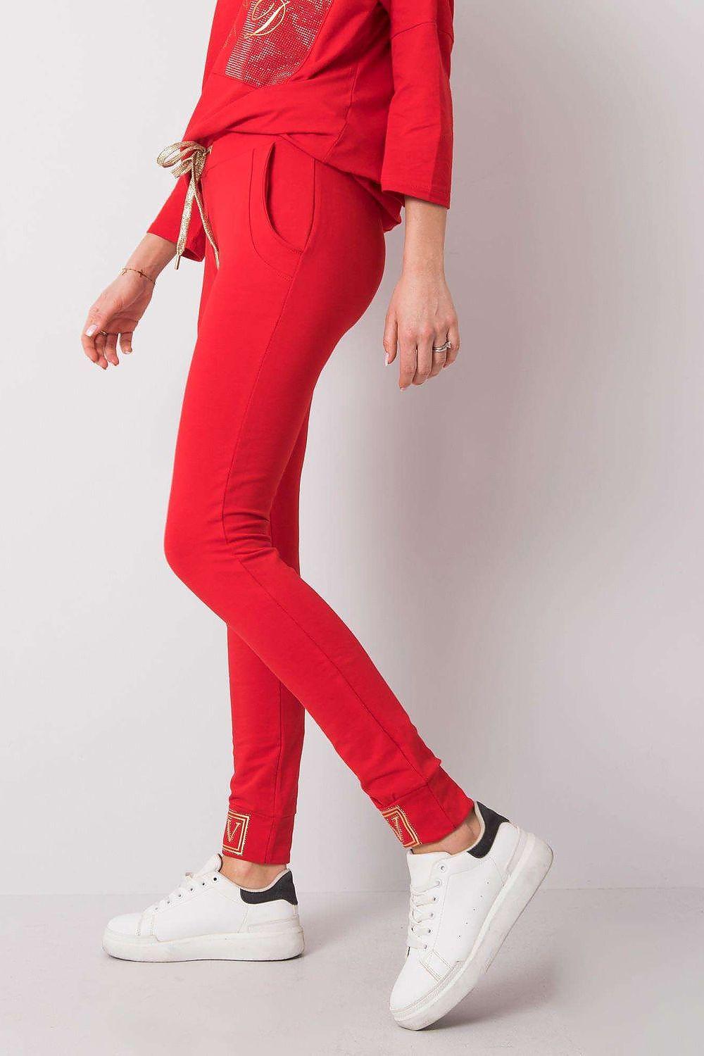 Red tracksuit trousers with side drawstring and tapered leg hems