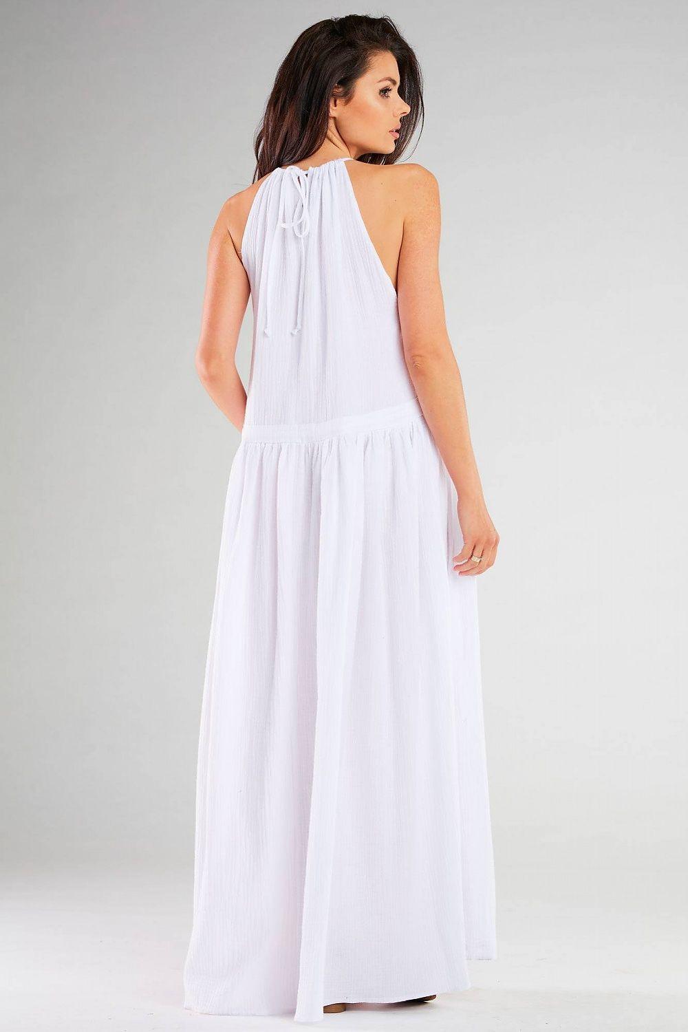 White daydress back view with halter neckline and gathered maxi skirt.