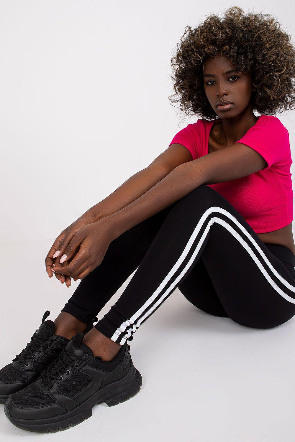 Black high-waisted leggings with double white side stripe, slim fit